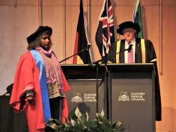 Ms Ellis on stage, about to receive her Honorary Doctorate.