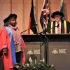 Ms Ellis on stage, about to receive her Honorary Doctorate.